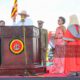President Yoweri Kaguta Museveni lifts the Bible while taking the oath of office for his seventh term as President of Uganda during the swearing-in ceremony at Kololo Independence Grounds. Looking on are First Daughter Natasha Museveni Karugire (L) and Chief Justice Flavian Zeija. (PHOTO BY ALEX MASEREKA JOEL)