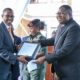 Speaker Jacobs Oboth-Oboth (R) hands over office to New Defence Minister Kiryowa Kiwanuka - UG DIPLOMAT